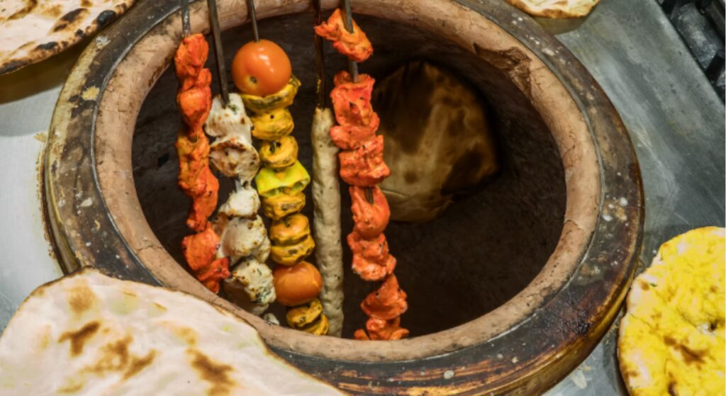 Traditional clay tandoor oven used to cook authentic Indian tandoori dishes